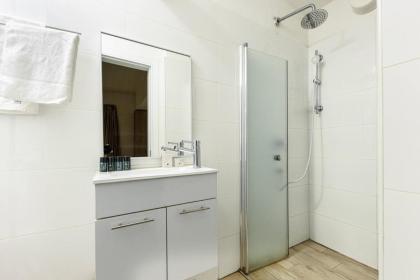 Stylish 3BR Apt w Balcony 5 min Walk from Beach by Sea N' Rent - image 9