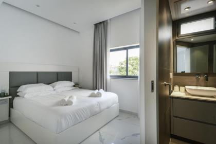 Bright & Modern 2BR Apt with Spacious Terrace 5-min from Beach by Sea N' Rent - image 30