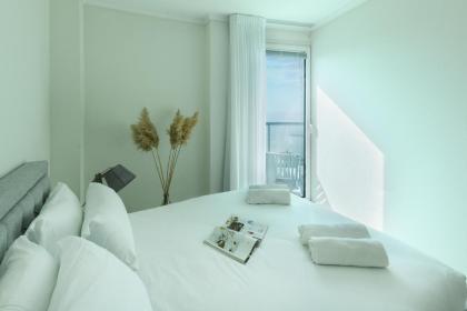 Luxury 2BR Apt w Balcony Pool Access & Beach View by Sea N' Rent - image 23