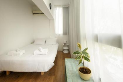 Cozy 2BR Apt w Green Oasis a 3 Min Walk from Beach by Sea N' Rent - image 21
