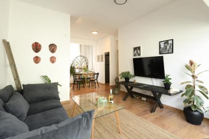 Cozy 2BR Apt w Green Oasis a 3 Min Walk from Beach by Sea N' Rent - image 24