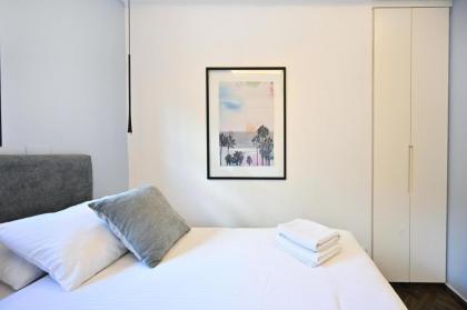 Stylish 3BR Garden Apartment Steps from the Beach - image 18